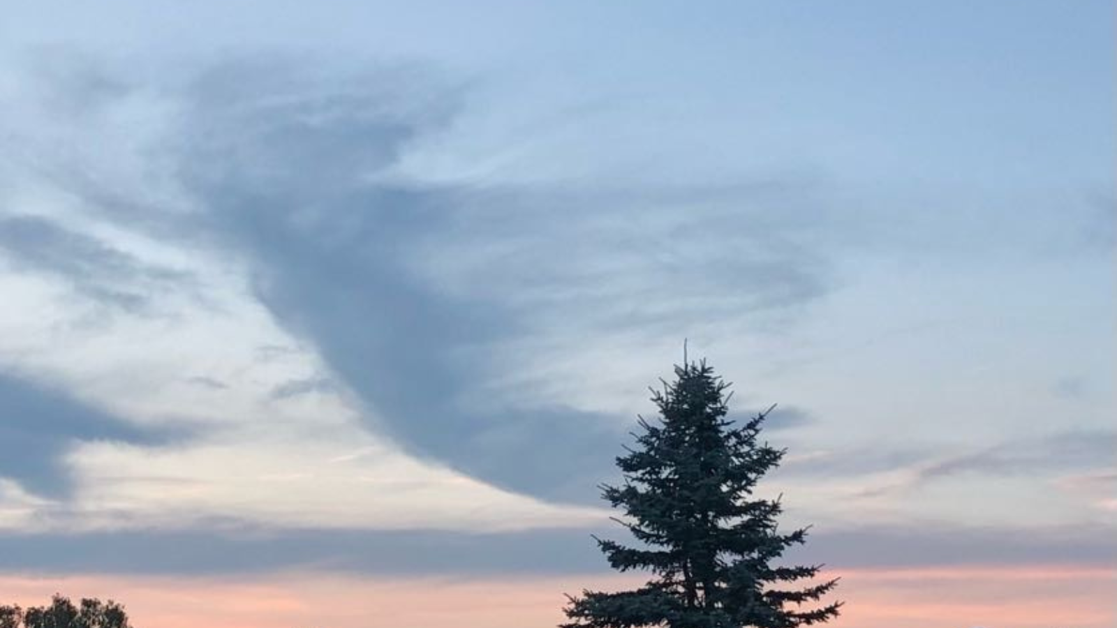 Cloud shaped like an angel, symbolizing peace and comfort during end-of-life planning.