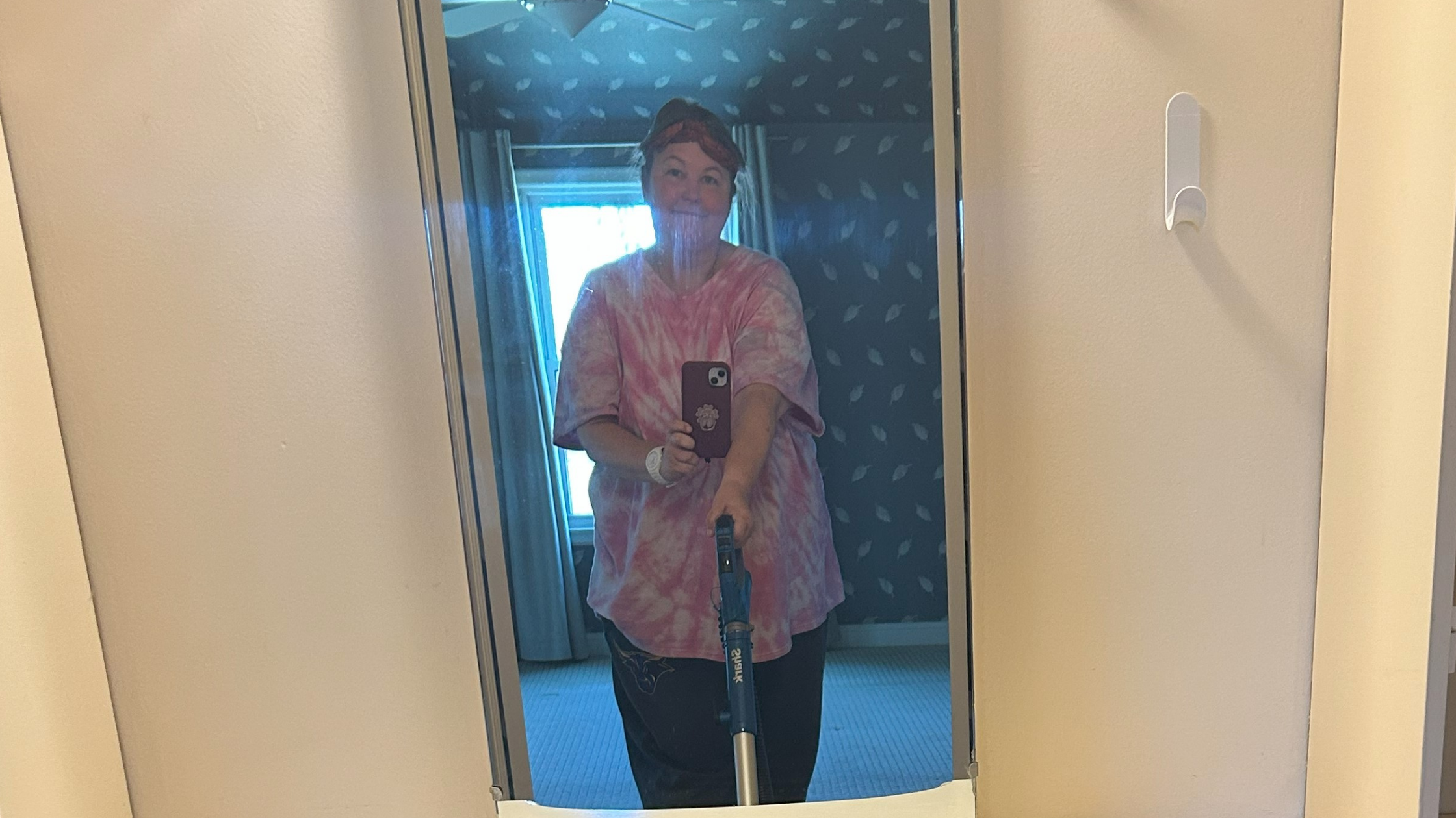Heidi vacuuming her parents’ home, revisiting childhood memories and reflecting on life transitions.